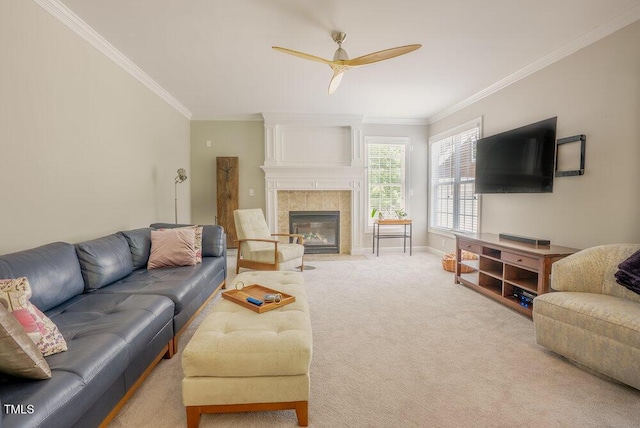 1005 Hidden River Ct, Raleigh, NC 27614 - living room featuring ornamental molding, carpet flooring, ceiling fan, a tile fireplace, and baseboards