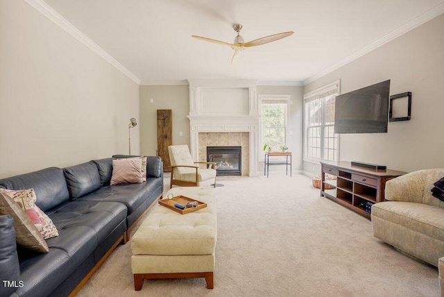 1005 Hidden River Ct, Raleigh, NC 27614 - living area with carpet floors, a ceiling fan, crown molding, a tile fireplace, and baseboards
