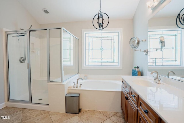 1005 Hidden River Ct, Raleigh, NC 27614 - bathroom with vanity, a shower stall, a garden tub, and tile patterned floors