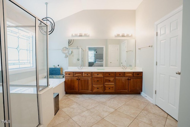 1005 Hidden River Ct, Raleigh, NC 27614 - bathroom featuring lofted ceiling, double vanity, healthy amount of natural light, and a bath