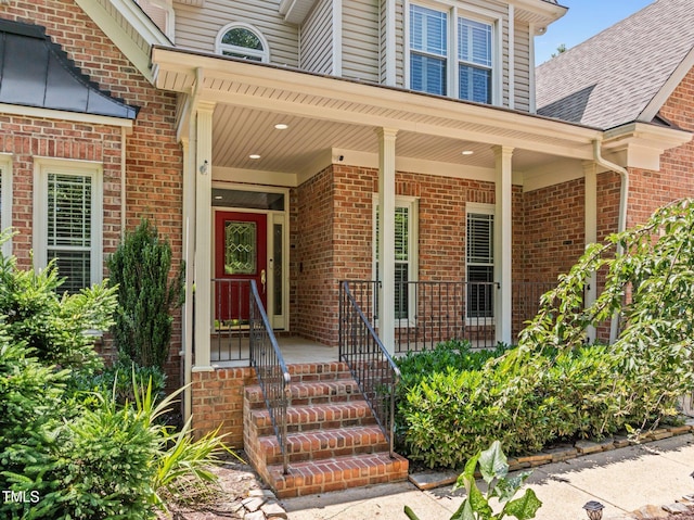 5108 Briton Pl, Fuquay Varina, NC 27526 - doorway to property with brick siding and a porch