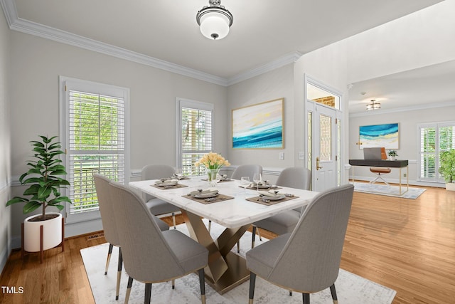 5108 Briton Pl, Fuquay Varina, NC 27526 - dining room featuring ornamental molding and wood finished floors