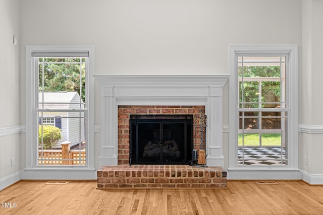 5108 Briton Pl, Fuquay Varina, NC 27526 - detailed view of wood finished floors, a fireplace, and baseboards