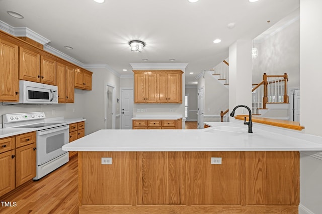 5108 Briton Pl, Fuquay Varina, NC 27526 - kitchen featuring white appliances, a sink, light wood-type flooring, light countertops, and recessed lighting