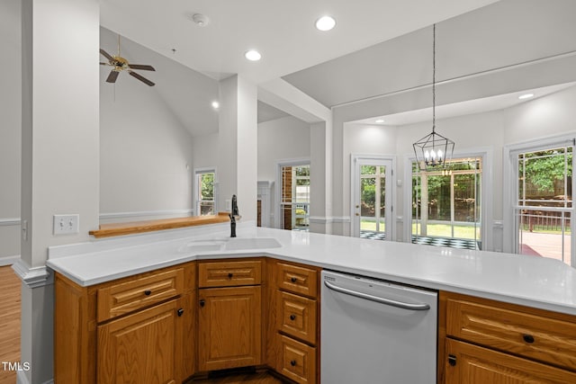 5108 Briton Pl, Fuquay Varina, NC 27526 - kitchen with dishwasher, a sink, wood finished floors, light countertops, and recessed lighting