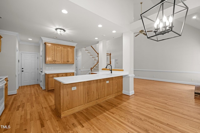 5108 Briton Pl, Fuquay Varina, NC 27526 - kitchen with light countertops, light wood-type flooring, recessed lighting, ornamental molding, and baseboards