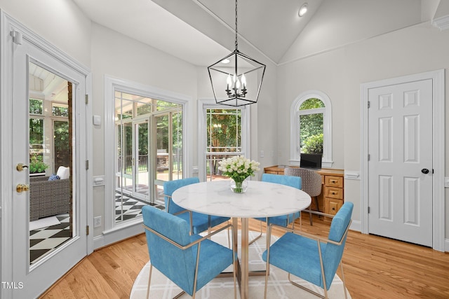 5108 Briton Pl, Fuquay Varina, NC 27526 - dining area with light wood finished floors, vaulted ceiling, and a chandelier