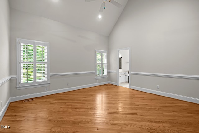 5108 Briton Pl, Fuquay Varina, NC 27526 - empty room with light wood-style floors, a ceiling fan, high vaulted ceiling, and baseboards