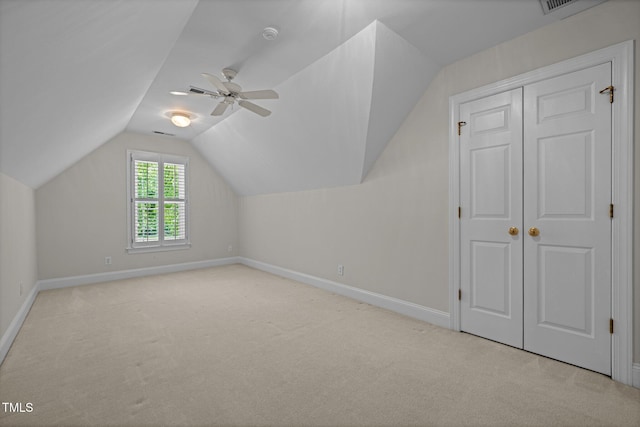 5108 Briton Pl, Fuquay Varina, NC 27526 - additional living space with light colored carpet, baseboards, lofted ceiling, and a ceiling fan