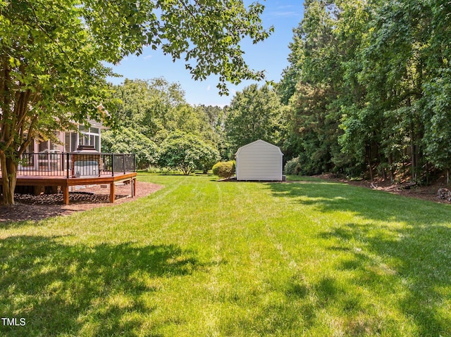 5108 Briton Pl, Fuquay Varina, NC 27526 - view of grassy yard featuring a wooden deck and a view of trees