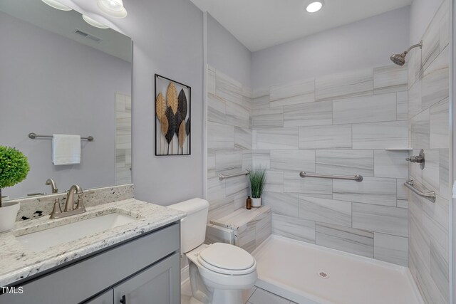 3020 High Plains Dr, Fuquay Varina, NC 27526 - full bath featuring vanity, tiled shower, and toilet
