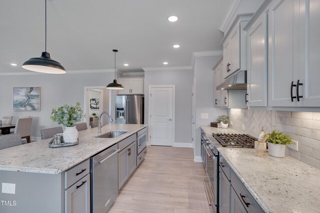 3020 High Plains Dr, Fuquay Varina, NC 27526 - kitchen featuring high end appliances, a sink, under cabinet range hood, recessed lighting, and ornamental molding