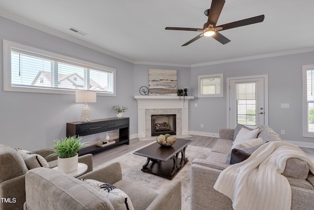 3020 High Plains Dr, Fuquay Varina, NC 27526 - living room with ceiling fan, a tile fireplace, crown molding, wood finished floors, and baseboards