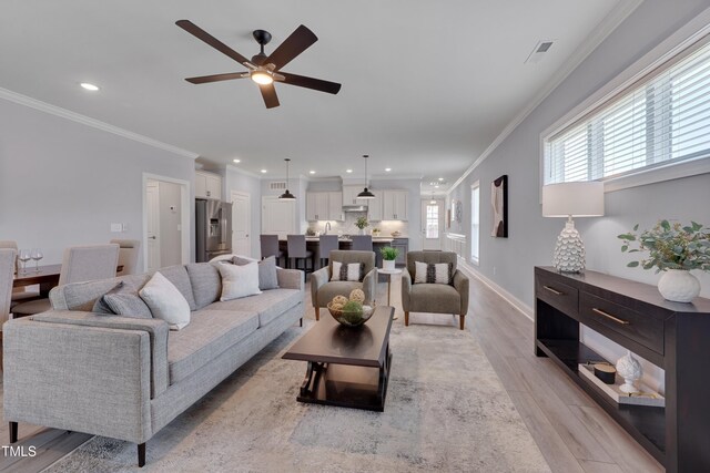 3020 High Plains Dr, Fuquay Varina, NC 27526 - living area featuring ceiling fan, light wood-style floors, ornamental molding, recessed lighting, and baseboards
