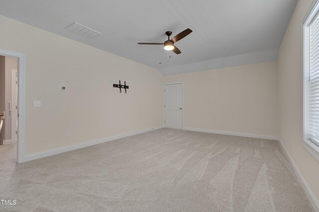 3020 High Plains Dr, Fuquay Varina, NC 27526 - empty room featuring a ceiling fan, light colored carpet, lofted ceiling, and baseboards
