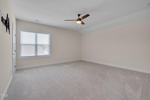 3020 High Plains Dr, Fuquay Varina, NC 27526 - spare room featuring light carpet, a ceiling fan, baseboards, and lofted ceiling