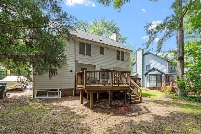 4108 Lazyriver Ln, Durham, NC 27712 - back of property featuring a wooden deck, a chimney, and stairway