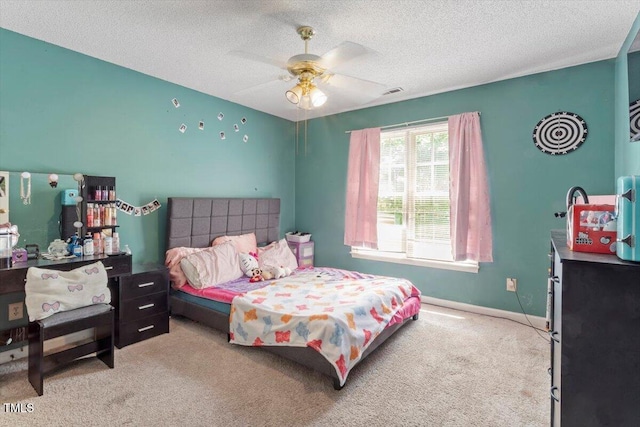 4108 Lazyriver Ln, Durham, NC 27712 - carpeted bedroom featuring a textured ceiling, a ceiling fan, and baseboards