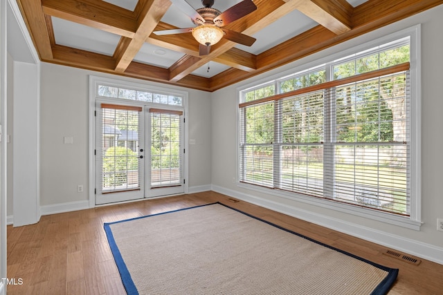 4913 Great Meadows Ct, Raleigh, NC 27609 - spare room with coffered ceiling, baseboards, light wood finished floors, a ceiling fan, and beamed ceiling