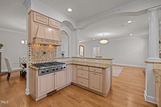 4913 Great Meadows Ct, Raleigh, NC 27609 - kitchen featuring ornate columns, stainless steel gas cooktop, light stone countertops, light brown cabinetry, and recessed lighting