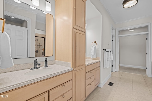 4913 Great Meadows Ct, Raleigh, NC 27609 - bathroom with vanity, tiled shower, ornamental molding, tile patterned floors, and baseboards