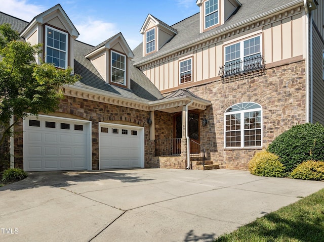 4913 Great Meadows Ct, Raleigh, NC 27609 - view of front of property featuring stone siding, board and batten siding, and driveway