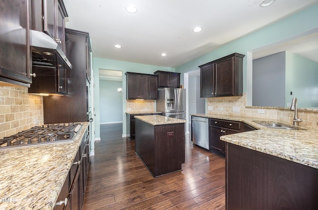 1305 Ivey Grove Ct, Fuquay Varina, NC 27526 - kitchen with stainless steel appliances, tasteful backsplash, dark brown cabinetry, light stone countertops, and dark wood-type flooring
