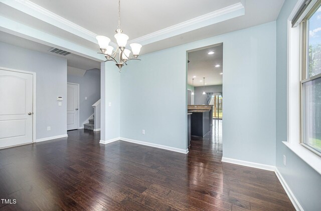 1305 Ivey Grove Ct, Fuquay Varina, NC 27526 - unfurnished room with dark wood finished floors, healthy amount of natural light, a chandelier, stairway, and ornamental molding