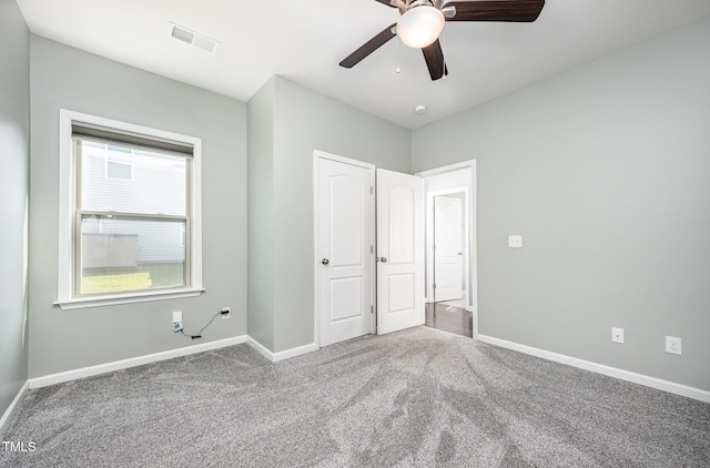 1305 Ivey Grove Ct, Fuquay Varina, NC 27526 - unfurnished bedroom featuring carpet and a ceiling fan