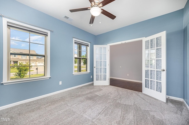 1305 Ivey Grove Ct, Fuquay Varina, NC 27526 - unfurnished room featuring french doors, carpet floors, and ceiling fan
