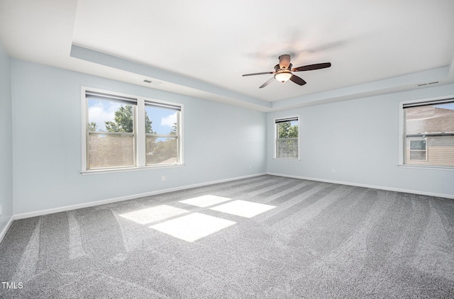 1305 Ivey Grove Ct, Fuquay Varina, NC 27526 - empty room with a raised ceiling, carpet floors, and ceiling fan