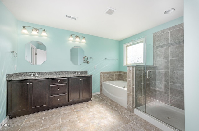1305 Ivey Grove Ct, Fuquay Varina, NC 27526 - full bathroom featuring a garden tub, double vanity, a stall shower, and tile patterned flooring