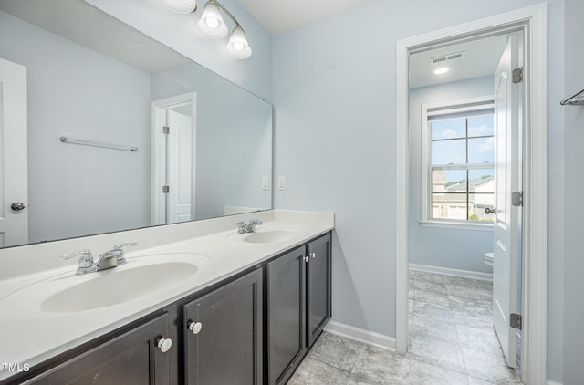 1305 Ivey Grove Ct, Fuquay Varina, NC 27526 - bathroom with double vanity and toilet