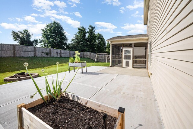 1305 Ivey Grove Ct, Fuquay Varina, NC 27526 - fenced backyard with a sunroom and a patio