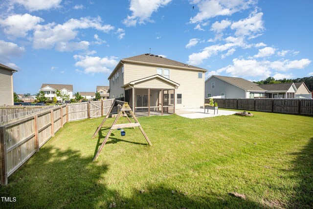 1305 Ivey Grove Ct, Fuquay Varina, NC 27526 - rear view of house featuring a sunroom, a residential view, a patio area, and a fenced backyard