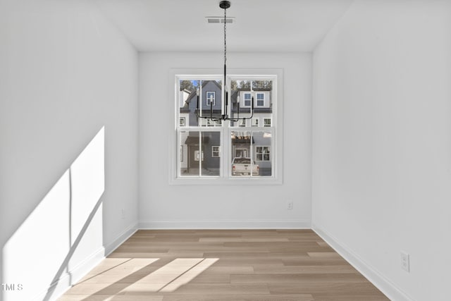 4821 Gossamer Ln Unit 102, Raleigh, NC 27616 - unfurnished dining area featuring light wood-style floors and baseboards