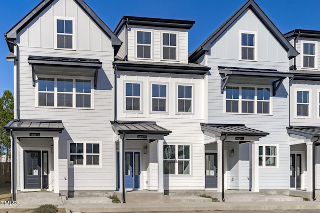 4821 Gossamer Ln Unit 102, Raleigh, NC 27616 - view of front of property with a standing seam roof, board and batten siding, and metal roof