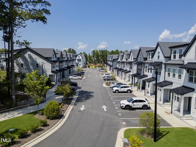 4821 Gossamer Ln Unit 102, Raleigh, NC 27616 - view of asphalt street with a residential view, sidewalks, and curbs
