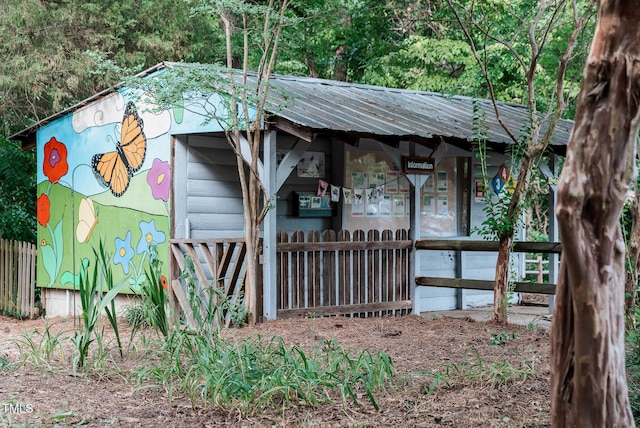 4821 Gossamer Ln Unit 102, Raleigh, NC 27616 - view of property exterior featuring metal roof