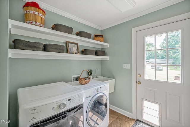 4702 Pleasant Green Rd, Durham, NC 27705 - washroom featuring washing machine and dryer, ornamental molding, and baseboards
