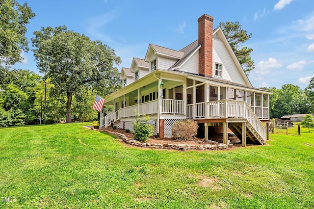 4702 Pleasant Green Rd, Durham, NC 27705 - rear view of house featuring a sunroom, stairway, a yard, and a chimney