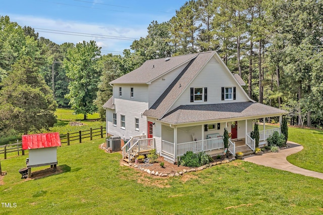4702 Pleasant Green Rd, Durham, NC 27705 - view of front of home with central AC, roof with shingles, covered porch, and view of scattered trees