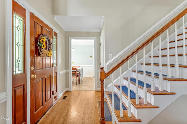 4702 Pleasant Green Rd, Durham, NC 27705 - foyer entrance featuring stairs, light wood-style flooring, and crown molding