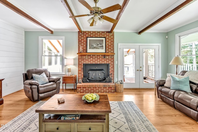 4702 Pleasant Green Rd, Durham, NC 27705 - living area featuring light wood finished floors, ornamental molding, ceiling fan, a fireplace, and french doors