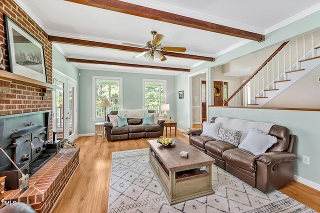 4702 Pleasant Green Rd, Durham, NC 27705 - living area featuring light wood finished floors, beamed ceiling, a ceiling fan, stairway, and baseboards