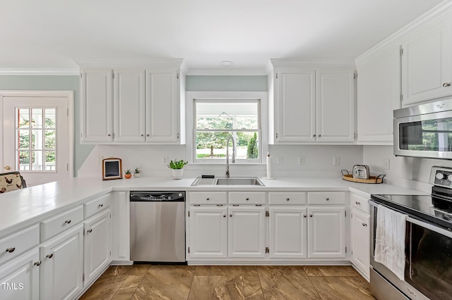 4702 Pleasant Green Rd, Durham, NC 27705 - kitchen featuring appliances with stainless steel finishes, a sink, crown molding, light countertops, and white cabinets