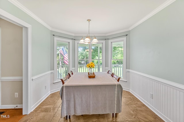 4702 Pleasant Green Rd, Durham, NC 27705 - dining room with plenty of natural light, a wainscoted wall, crown molding, and a chandelier