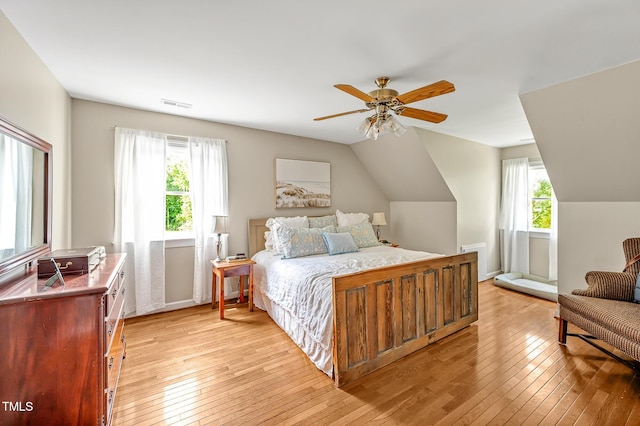 4702 Pleasant Green Rd, Durham, NC 27705 - bedroom with light wood-style floors, vaulted ceiling, and a ceiling fan