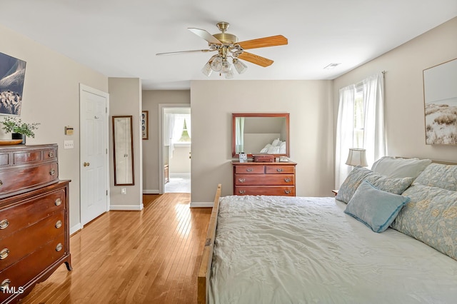 4702 Pleasant Green Rd, Durham, NC 27705 - bedroom featuring multiple windows, light wood-style flooring, baseboards, and a ceiling fan