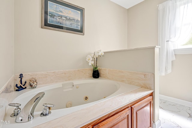 4702 Pleasant Green Rd, Durham, NC 27705 - bathroom with a whirlpool tub, marble finish floors, and baseboards